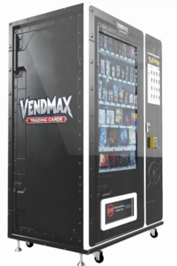 Joe Lustig with trophy in front of VendMax Pokémon vending machine